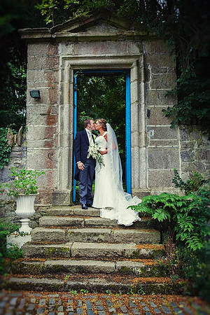 Ian and Martina kiss in the doorway