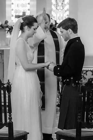 Clara and Odie holding hands at their ceremony