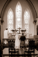 Clara and Odie kneeling at the altar
