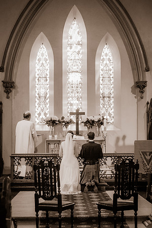 Clara and Odie kneeling at the altar